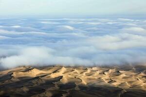 An Aerial view over the vast sand dunes that make up the great sand sea in Namibia. photo