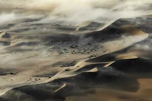 An Aerial view over the vast sand dunes that make up the great sand sea in Namibia. photo