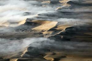 An Aerial view over the vast sand dunes that make up the great sand sea in Namibia. photo