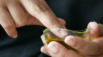 women hand using olive oil video