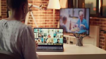 Woman attends videocall meeting with partners online, discussing about important freelancing tasks to finish. Teleworker talking to contractor on telework chat, remote job at home. video