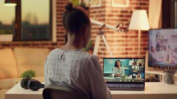 Woman meeting with clients on videocall, explaining price list and services provided to build strong online career in freelancing. Person using telework remote call at home, sunset light. video