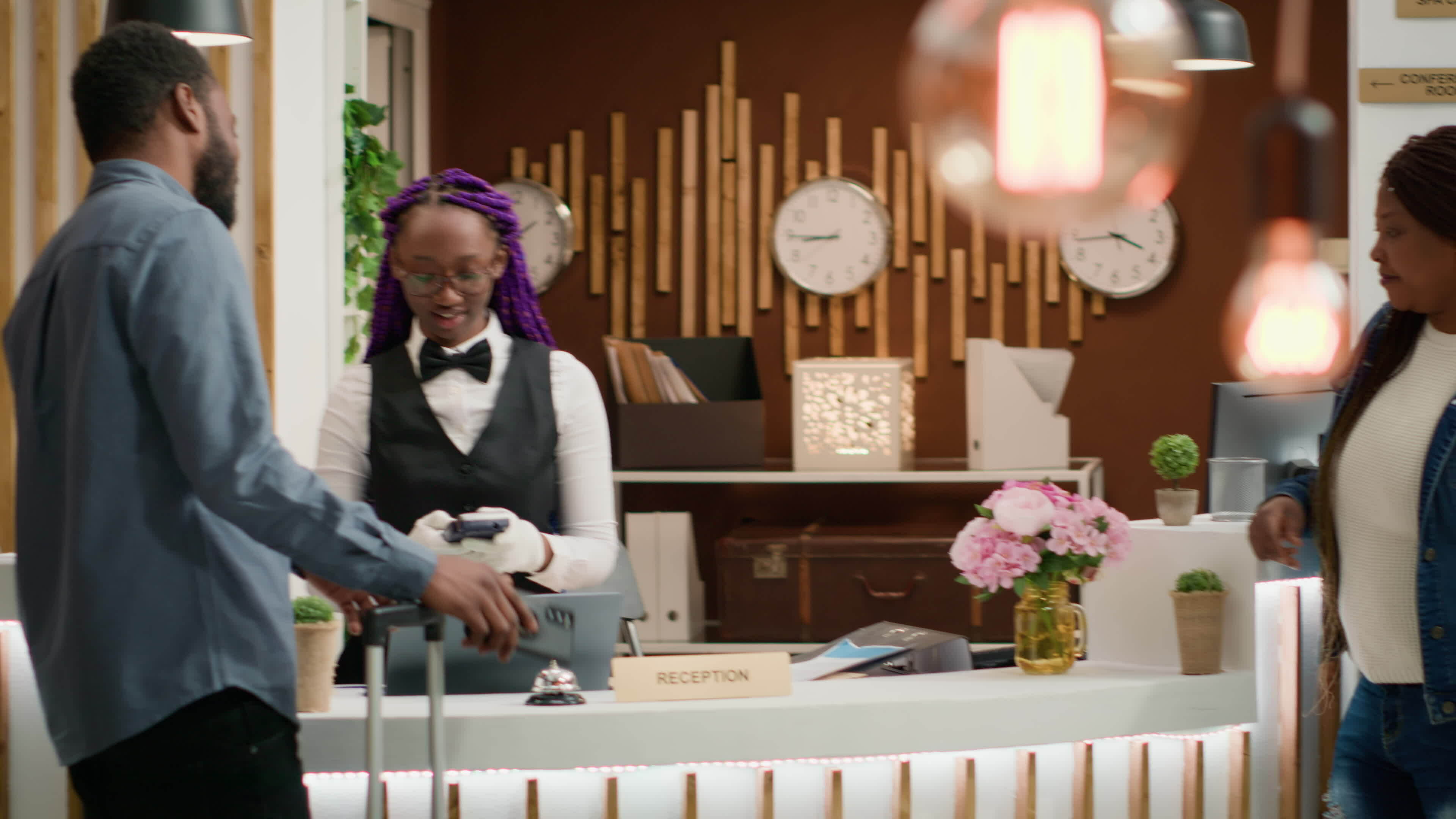 Guests leaving access key card at reception after amazing holiday