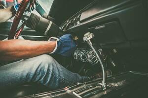 Classic Cars Professional Mechanic Examining a Vehicle photo