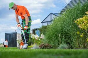 Caucasian Garden Owner and the Lawn Edger Job photo