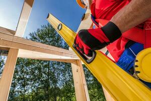 Wooden Frame Levels Check with Bubble Spirit Level Tool photo