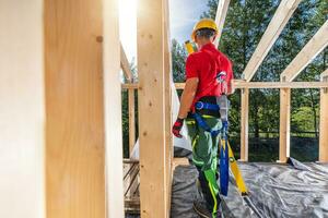 Professional Construction Contractor Wearing Safety Harness photo