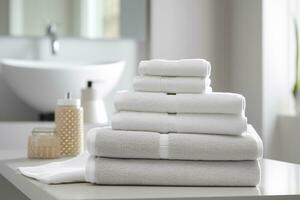 el del mundo más suave toallas en contra un minimalista antecedentes. apilado blanco toallas sentar en parte superior de un jabón plato en un baño. ai generativo foto