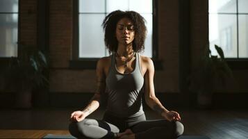 a black woman practicing yoga photo