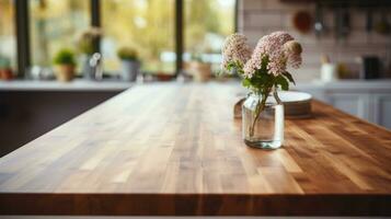 A wooden table top is shown in sharp focus against a blurred kitchen background in a detailed photograph photo