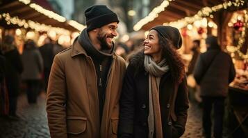 Couple enjoying Christmas market walking near stalls photo