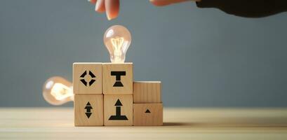 Creative idea, solution and innovation concept. Idea generation for business development. Wooden cube blocks with light bulb and cycle icons on clean background and copy space. AI Generative photo