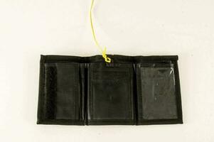 a black wallet with a yellow string photo