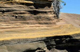 a rock face with lines photo