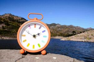 A clock on a rock photo