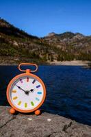 A clock on a rock photo