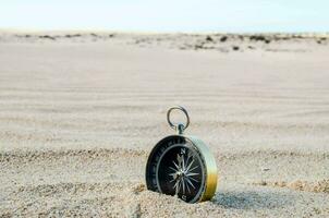 A compass in the sand photo