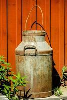 an old rusty milk can photo