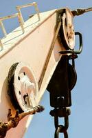 a close up of a crane with a chain photo