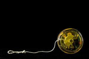 A yo-yo on black background photo