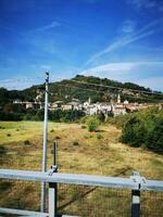 Photo of a cityscape view from a fence