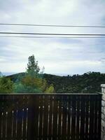 Photo of a wooden bench on a beautiful wooden deck