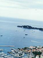 Photo of a picturesque harbor with boats floating in the gleaming water