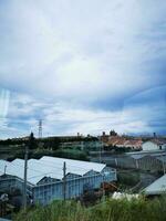 Photo of a cityscape seen through a train window