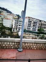 Photo of a street sign on a pole on a sidewalk