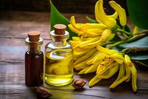 ylang ylang or cananga odorata flower essential oil alongside ylang ylang or cananga odorata flower on a table photo