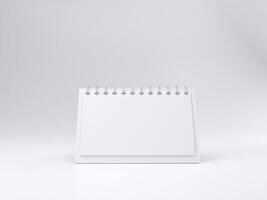 3D render empty white desk calendar mockup template photo with white background front left view