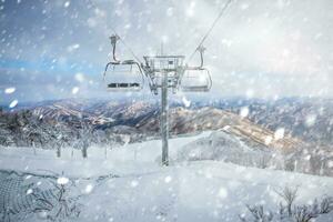 Cable car atop the snow-capped Deogyusan mountains at deogyusan national parkon a snowy day near Muju, South Korea. photo