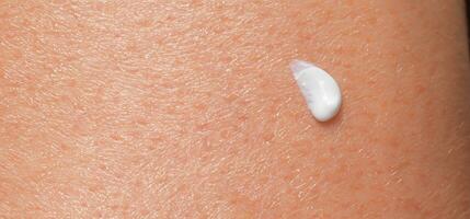 AI Generative Close up of Sunscreen Protection or Sun Cream on human skin. photo