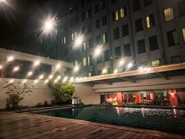 atmosphere at night at the hotel terrace swimming pool photo