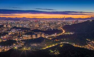 Seoul City skyline and downtown and skyscraper at night  is The best view and beautiful of South Korea at Namhansanseong mountain. photo