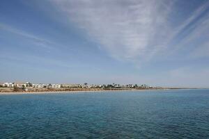 resort at the red sea egypt with white buildings and palm trees on vacation photo