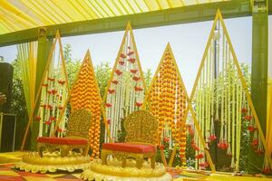 Flower decoration for haldi function in Indian wedding at home photo