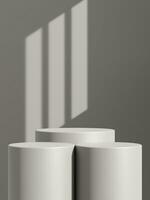 Empty gray podium or pedestal display on gray shadow background with cylinder stand concept photo