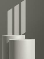 Empty gray podium or pedestal display on gray shadow background with cylinder stand concept photo