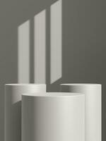 Empty gray podium or pedestal display on gray shadow background with cylinder stand concept photo