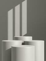 Empty gray podium or pedestal display on gray shadow background with cylinder stand concept photo