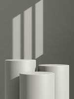 Empty gray podium or pedestal display on gray shadow background with cylinder stand concept photo