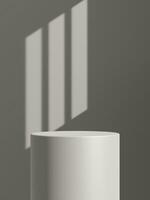 Empty gray podium or pedestal display on gray shadow background with cylinder stand concept photo