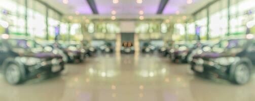 new cars in showroom interior blurred abstract background photo