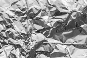 Shiny metal silver gray foil crumpled texture background photo