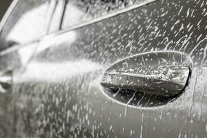 car cleaning and washing with foam soap photo