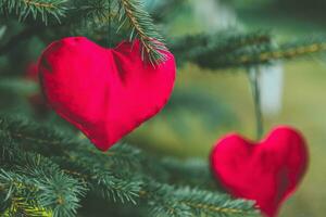 Handmade stuffed hearts. Handmade Christmas decoration ideas for children. Environment, recycle and zero waste concept. Selective focus, copy space photo