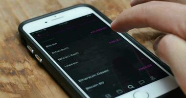 Trader Checking Cryptocurrency Pricing on App video