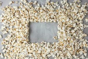 Popcorn mockup on gray background. Cinema, movies and entertainment concept. Top view, copy space photo