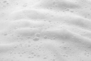 Abstract white soap foam bubbles texture background photo